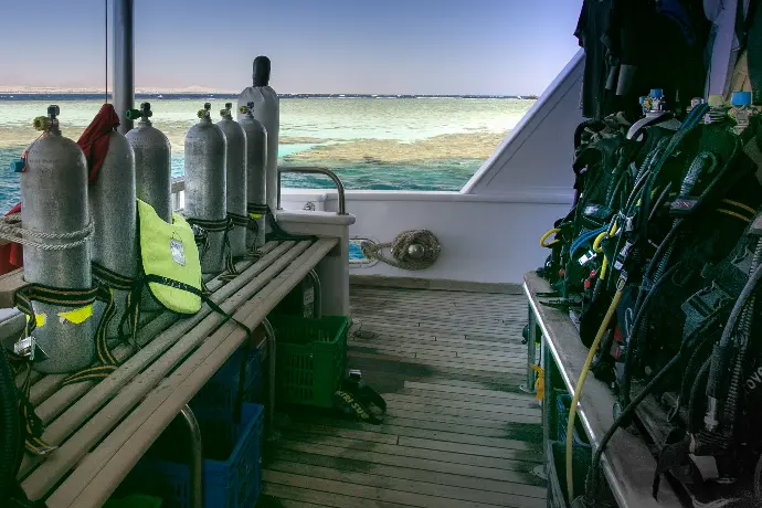a row of scuba equipment sitting on top of a boat